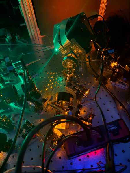 Combined spatial light modulator and digital micromirror device optical setup